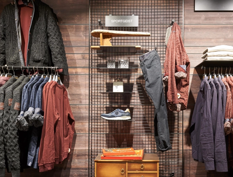 women’s and men’s fashion departments - reconstruction - redesign - Ganzbeck Neuötting - mens department - wooden arrangement wall