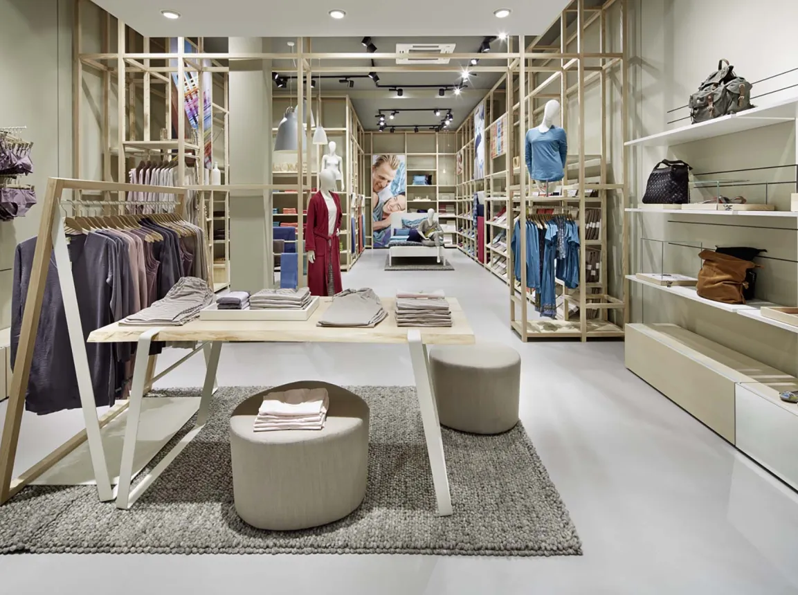 Monobrand concept - nature fashion brand - design and realisation - Hessnatur Frankfurt - store overview - clothes display tables