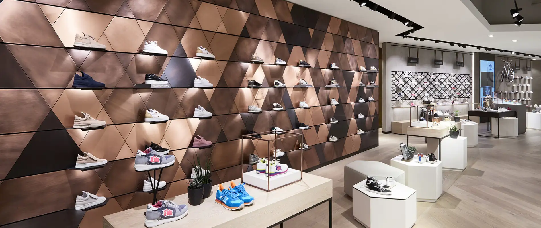 fashion house - conversion and modernisation - department store - Leffers Oldenburg - bronze panneled shoe display wall