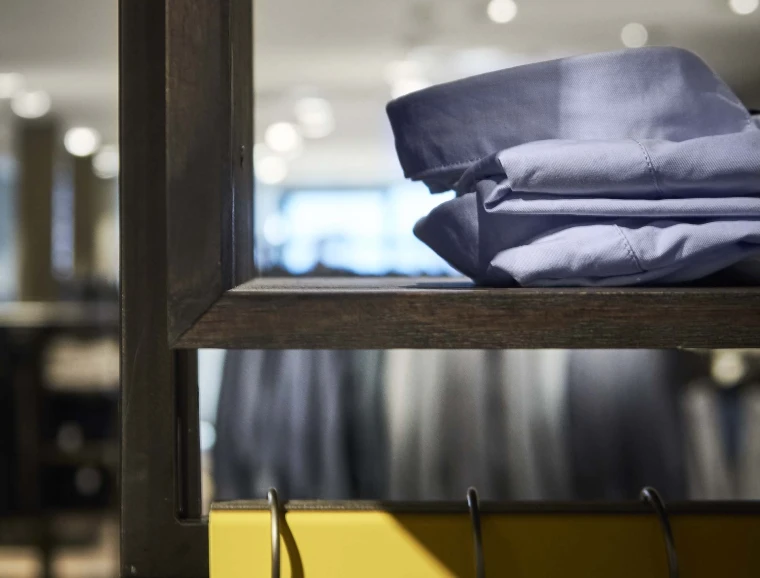 fashion house - conversion and modernisation - department store - Leffers Oldenburg - hanging rack detail - steel - dark wood