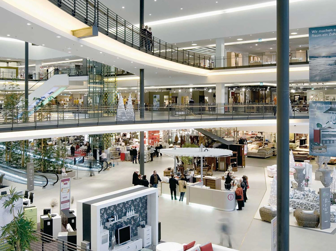 furniture store - new construction - facade design - Möbel Rieger Esslingen - entrance area inside - high angle - open area
