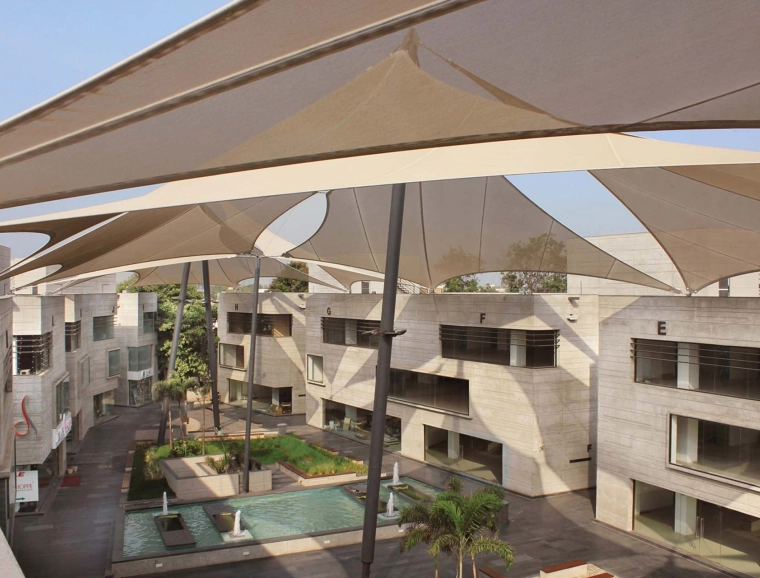 retail and business park - retail -  service facilities - restaurants - new construction - Mondeal Retail Park Ahmedabad - birds eye view onto plaza - shading sails in detail