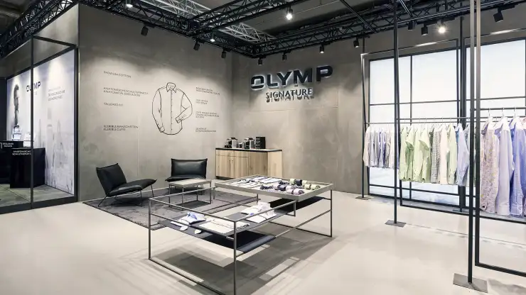 Signature fair booth - Concept und realisation - Olymp Signature Premium Berlin 2017 - view to logo wall with infographic