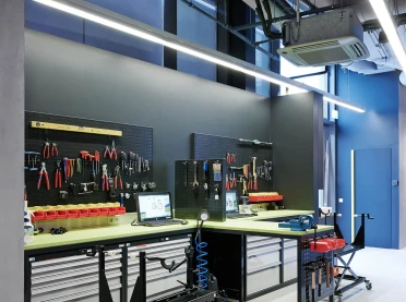 bike sports specialist store - new conception - Rose Biketown Munich - bike repair workshop area - workbenches