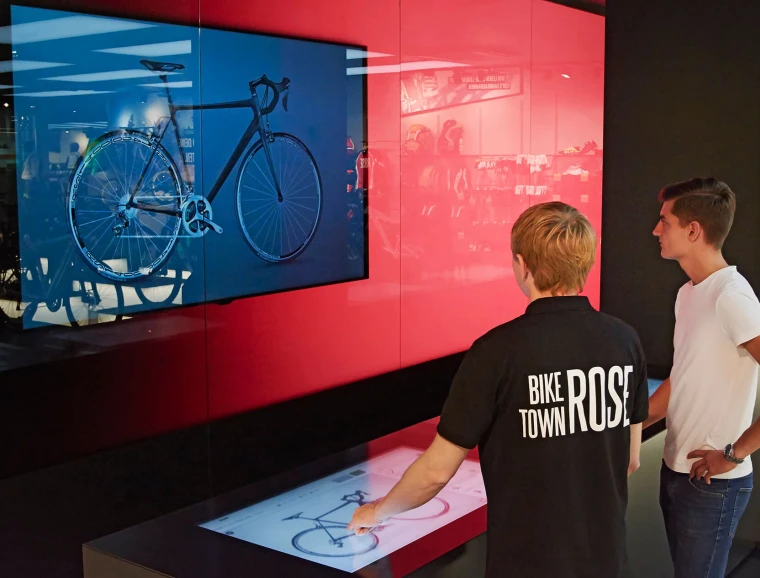 bike sports specialist store - new conception - Rose Biketown Munich - bike customizing area - tablets - led screen displays - red glass wall