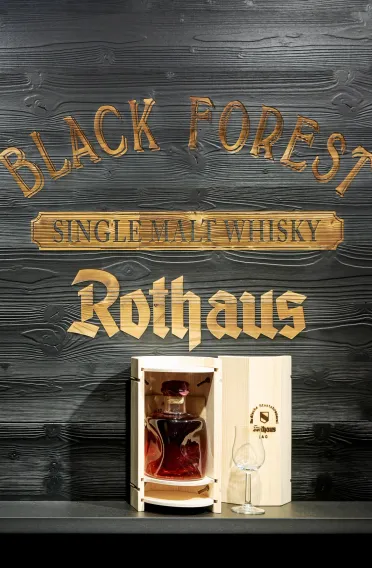 brewery fanshop - beer - conception and realization - Rothaus Grafenhausen -  whiskey arrangement detail - golden letters on black wood