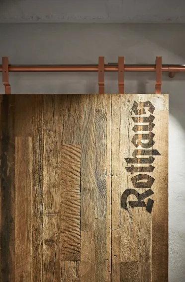 brewery fanshop - beer - conception and realization - Rothaus Grafenhausen -  interior detail - logo branded wood - chopper pipes