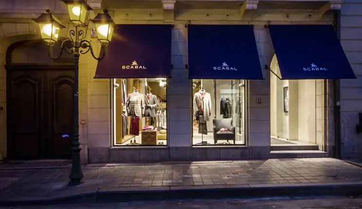 Flagship Store - luxury brand - clothing and suits - Scabal Brussels - store facade - entrance area - illuminated store windows - by night