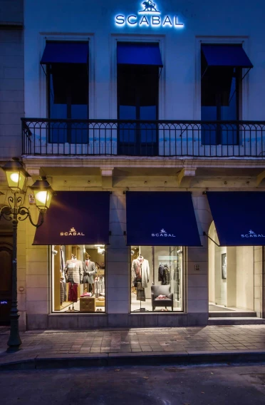 Flagship Store - luxury brand - clothing and suits - Scabal Brussels - store facade - entrance area - illuminated store windows - by night