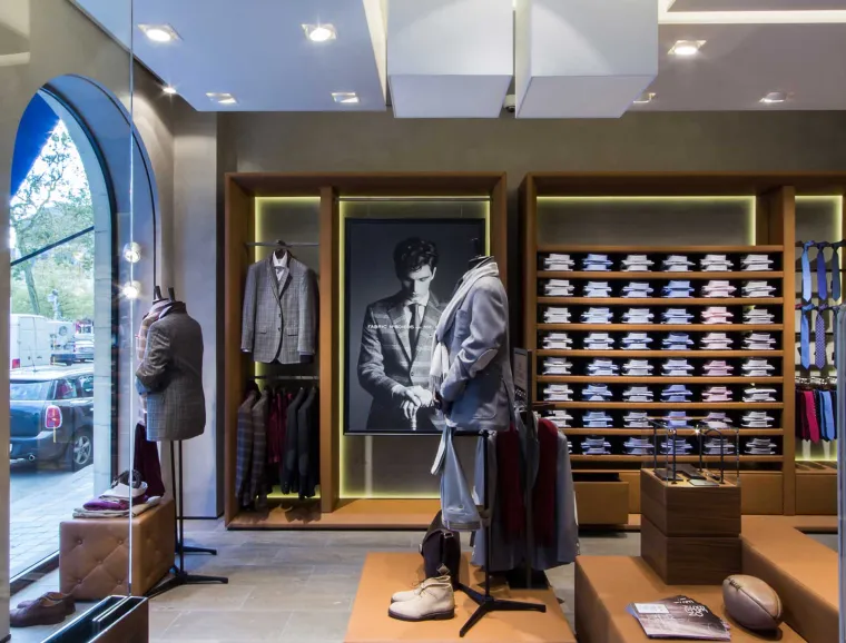 Flagship Store - luxury brand - clothing and suits - Scabal Brussels - leather  covered display frames - leather covered platforms - entrance area
