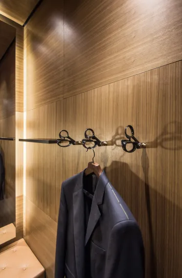 Flagship Store - luxury brand - clothing and suits - Scabal Brussels - fitting room detail - alienated scissors as coat hooks