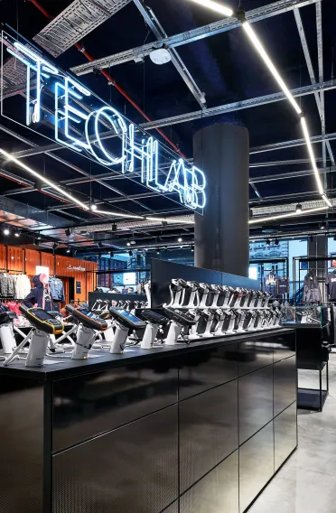 sports store - interior redesign - SportScheck Nuremberg - techlab area - technical gear detail - neon lights