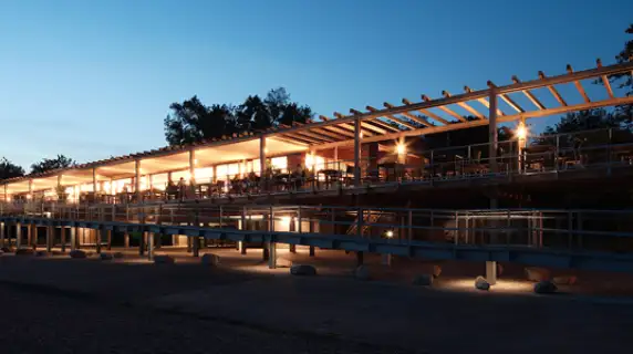 gastronomy building - construction - green building standards - competition - Strandbad Mannheim - outside building overview - wood-frame construction - illuminated by night