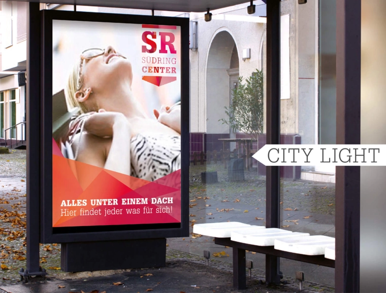 logo development - corporate design - guiding system - diverse implementations - corporate design - Südring Center - advertising example - poster on light box - at bus stop - city light