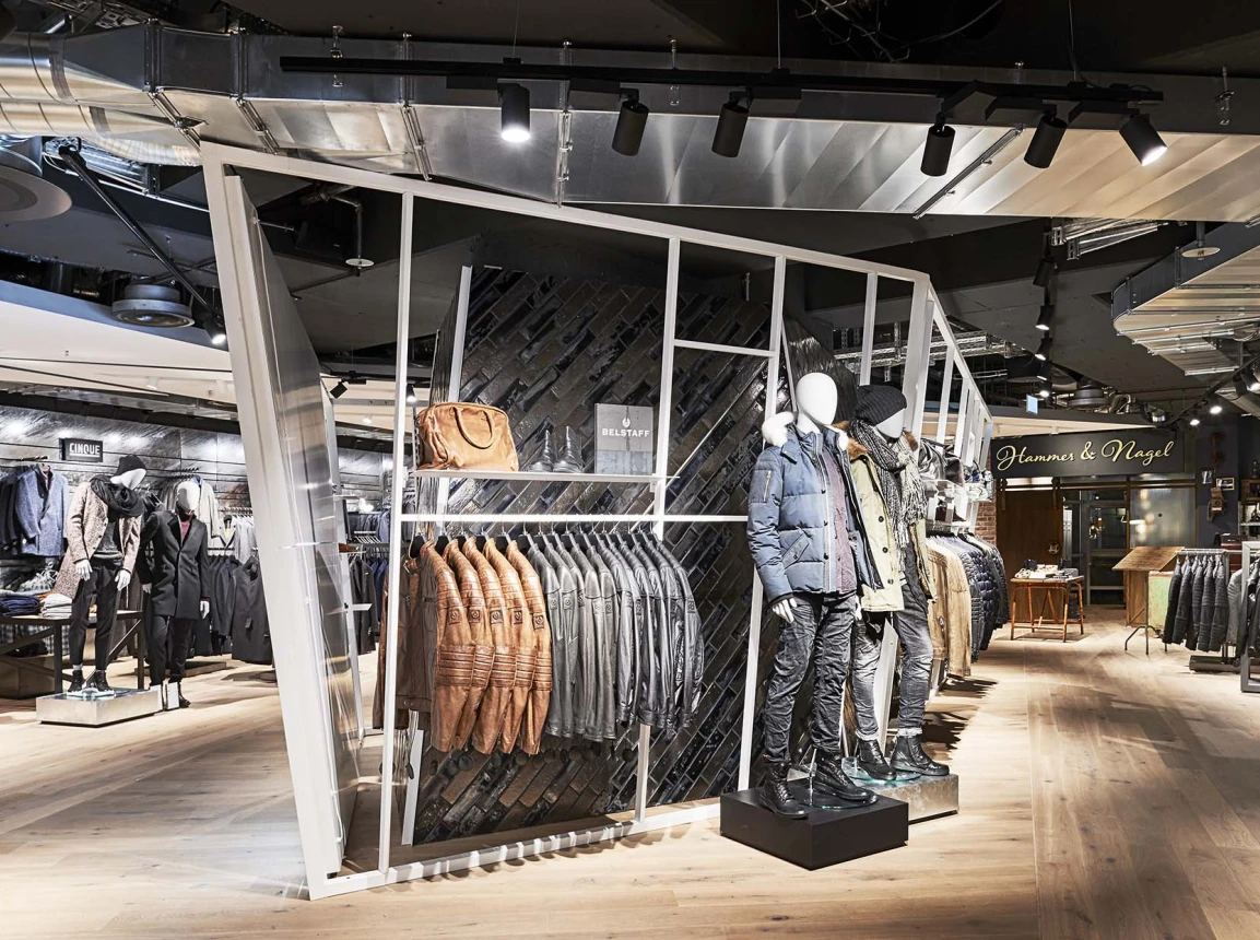 Men's Fashion Store - conception - realisation - Wormland Nuremberg - store overview - central dispay rack - black tile cladded wall