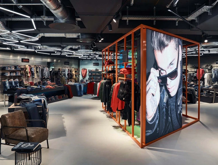 Men's Fashion Store - conception - realisation - Wormland Nuremberg - orange steel central display rack - store view from inside