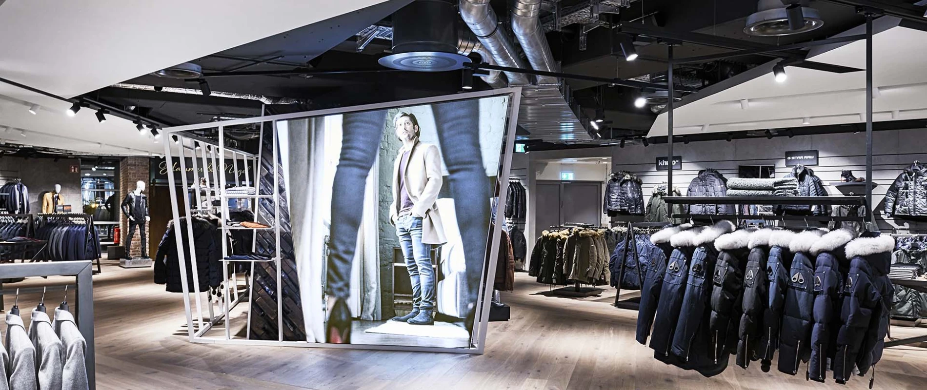 Men's Fashion Store - conception - realisation - Wormland Nuremberg - store overview - central dispay area - poster wall